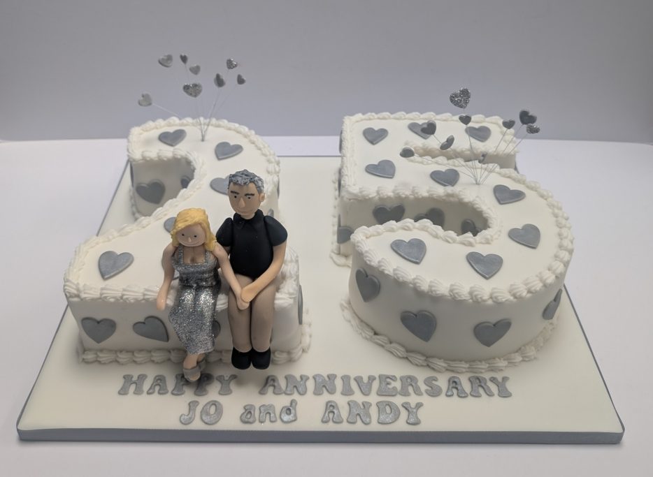 25th Wedding anniversary cake with the happy couple